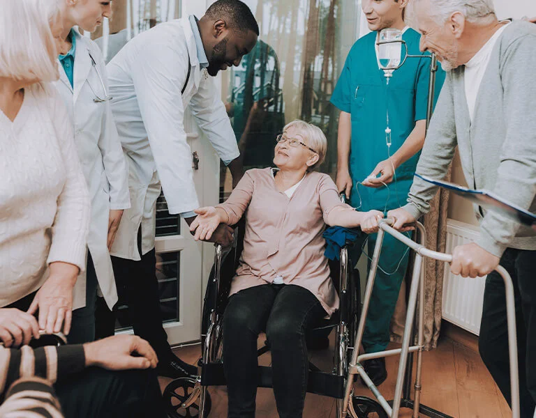 doctors serving a group of older adults